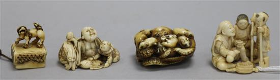 Four Japanese ivory netsuke, an okimono, an octopus and rats, a shi-shi maiju type netsuke, and two figure groups